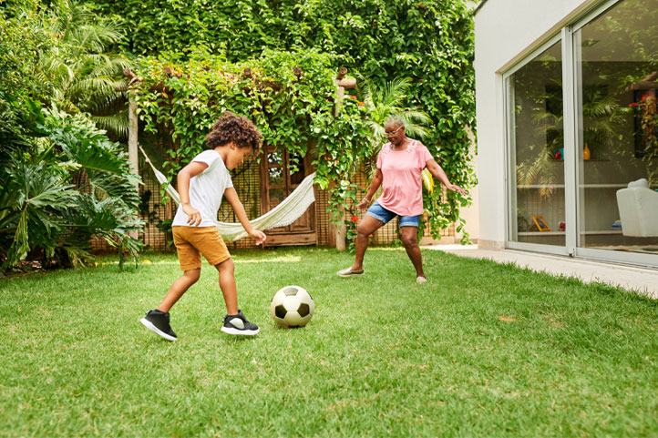 playing soccer in the backyard